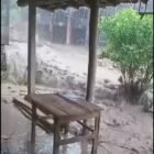 Warga Dusun Pule Tancep, Kabupaten Gunungkidul, DIY, membersihkan lumpur dan batu yang terbawa banjir bandang usai hujan deras mengguyur wilayah tersebut, Selasa (17/2/2026) sore.