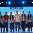 Sekretaris Daerah (Sekda) Aceh, M. Nasir, menyampaikan sambutan tertulis Gubernur Aceh pada pergelaran Bhayangkara Fest 2026 di halaman Mapolda Aceh, Banda Aceh, Senin (23/6/2026) malam.