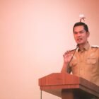 Sekretaris Daerah (Sekda) Aceh, M. Nasir, memberikan sambutan dalam pembukaan High Level Meeting (HLM) TPID dan TP2DD Aceh di Hotel Harmoni, Kota Langsa, Senin (6/7/2026).