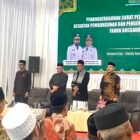 Plt. Kepala Dinas Pendidikan Dayah (DPDA) Aceh, Muhsin, S.Pd.I., M.Pd.I., memberikan pengarahan tegas dalam acara penandatanganan NPHA dan SPS pembangunan prasarana dayah TA 2026 di Aula Jeddah Asrama Haji, Banda Aceh, Kamis (9/7/2026). 